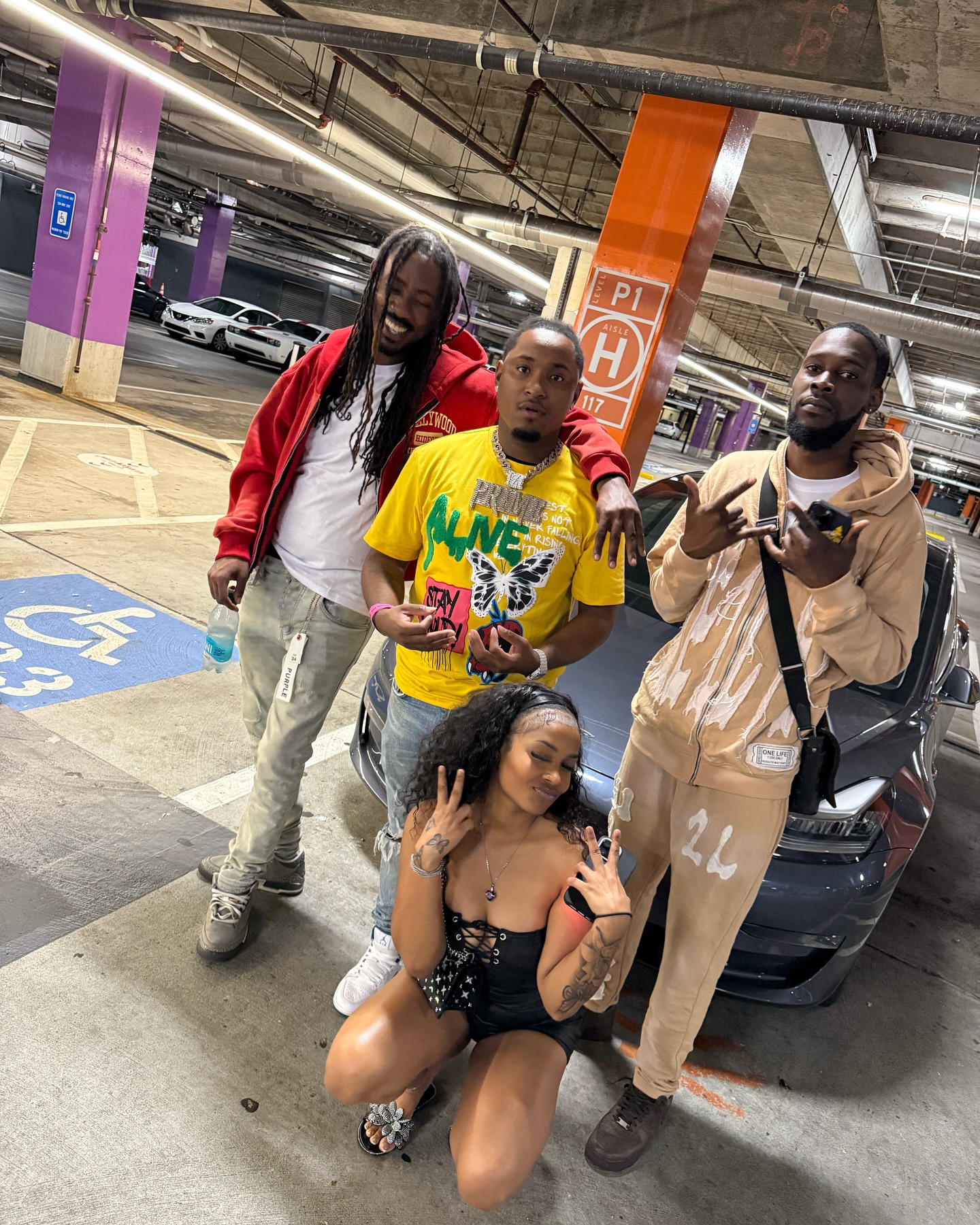 STC.44E with friends in a parking garage
